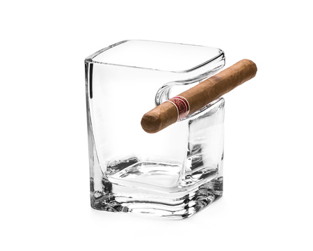 Whisky cigar holding glass